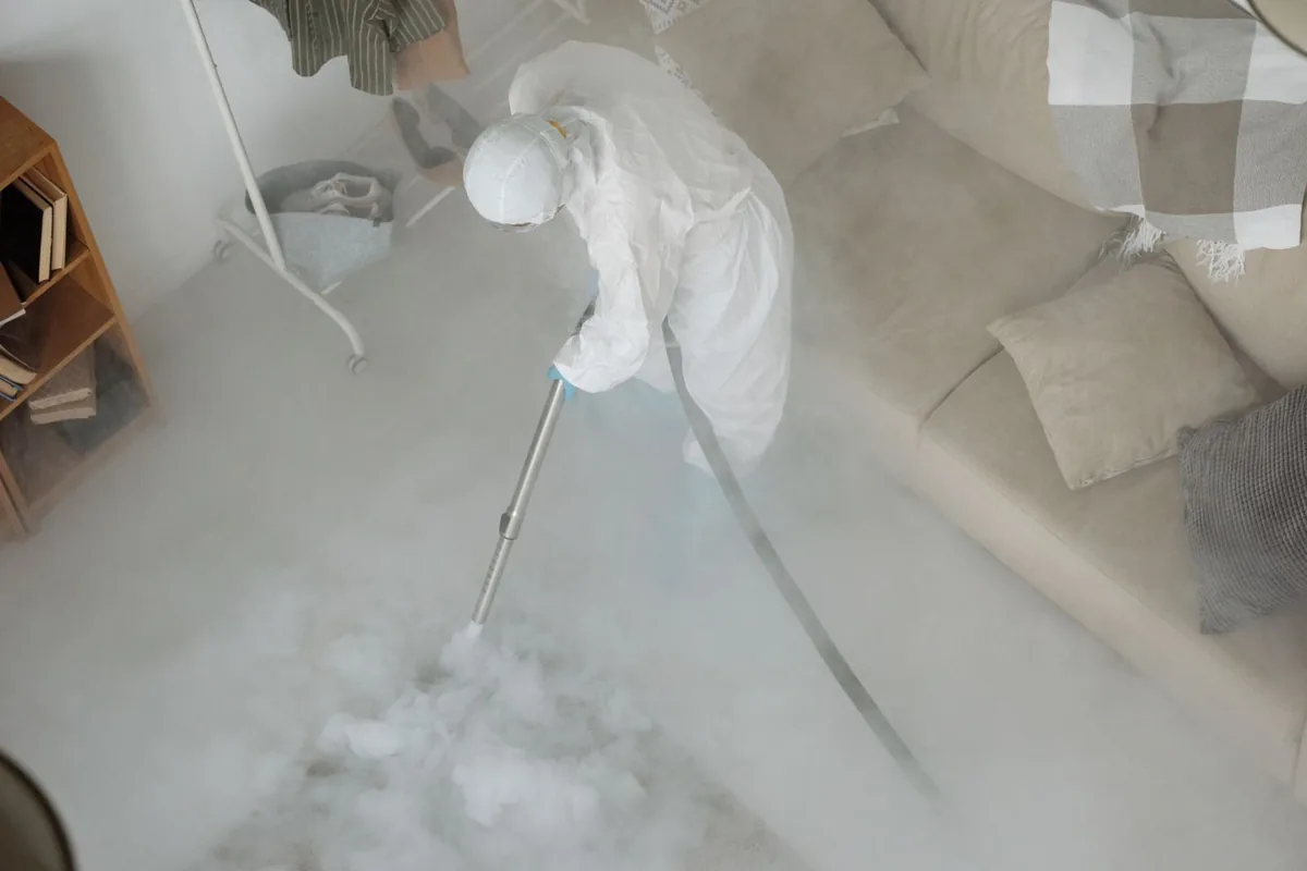 Biohazard cleanup technician in protective equipment, Auburndale, FL